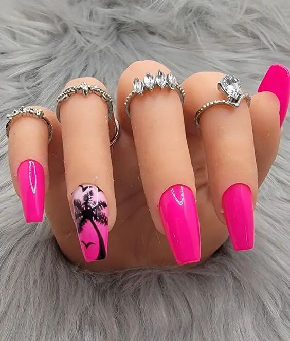 Bold Pink Nail Art with Tropical Palm Design and Silver Accents for a Playful Summer Look.