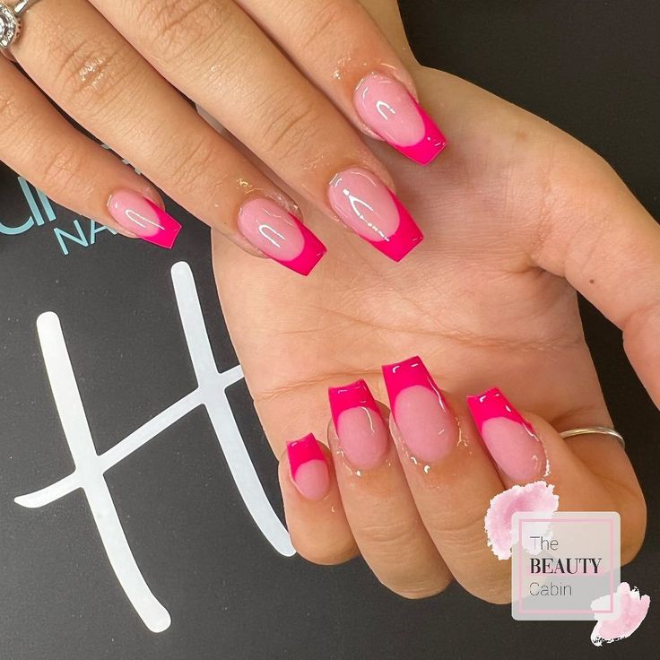 Bold Vibrant Pink French Tips with Ombre Effects for a Chic Nail Design.