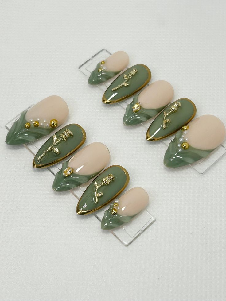 Luxurious Earthy Green and Nude Nail Design with Intricate Gold Accents