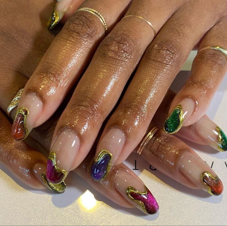 Vibrant Jewel-Toned Swirling Nail Design with Glossy Nude Base and Elegant Gold Accents.