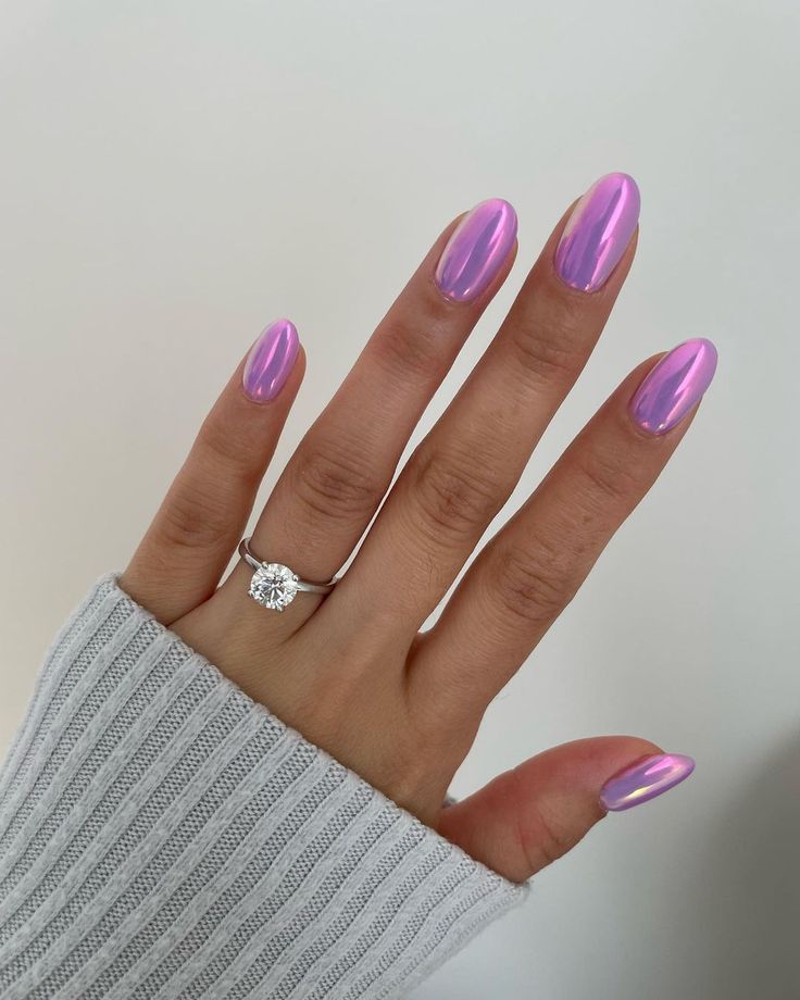 Iridescent Sparkling Pink Almond-Shaped Nails for Glamorous Occasions.