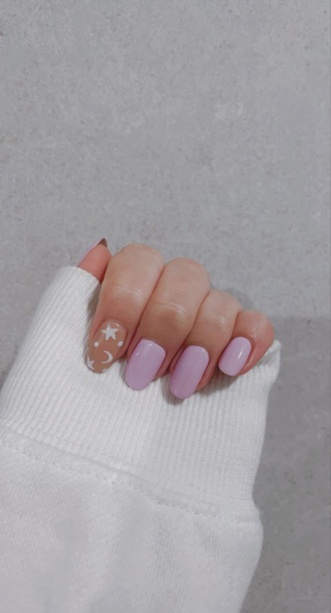 Charming Lavender Nail Design with Whimsical Star and Moon Accent.