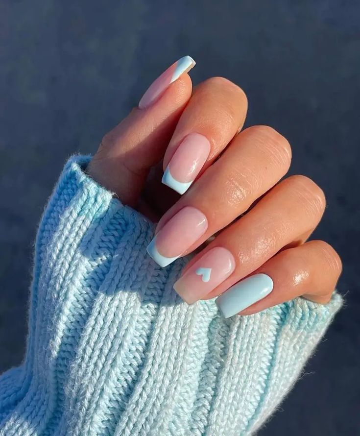 Playful Pastel Nail Design: Soft Pink, Light Blue, and Heart Motif for Cozy Elegance.