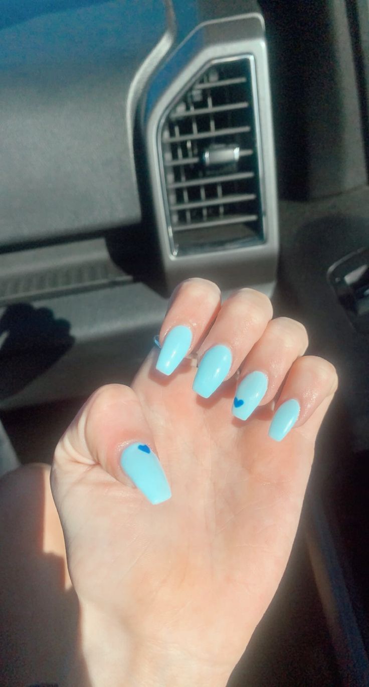 Chic Pastel Blue Nails with Glossy Finish and Playful Heart Accents