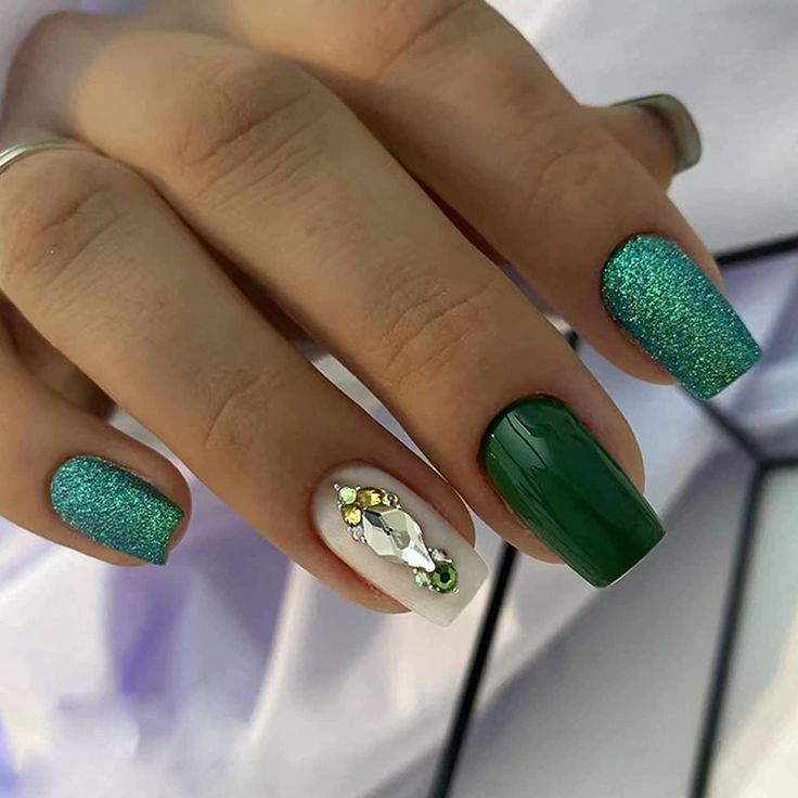 Vibrant Green Nail Design: Textured Glitter Meets Glossy Elegance with Accentuated Embellishments.