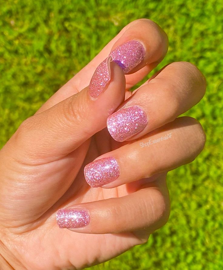 Playful Glittery Pink Gradient Nails for Glamorous Expression.