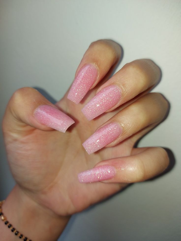 Elegant Soft Pink Glitter Nails with Gradient Effect for Any Occasion.