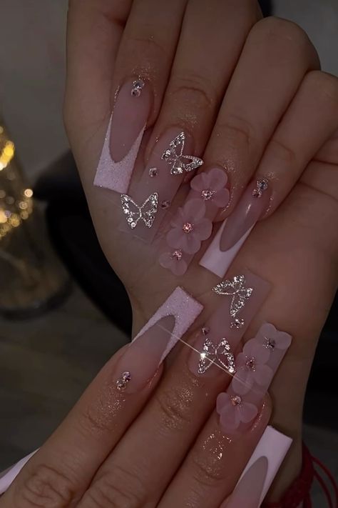 Whimsical Sophistication: Delicate Pink Nail Design with Butterflies and Rhinestones