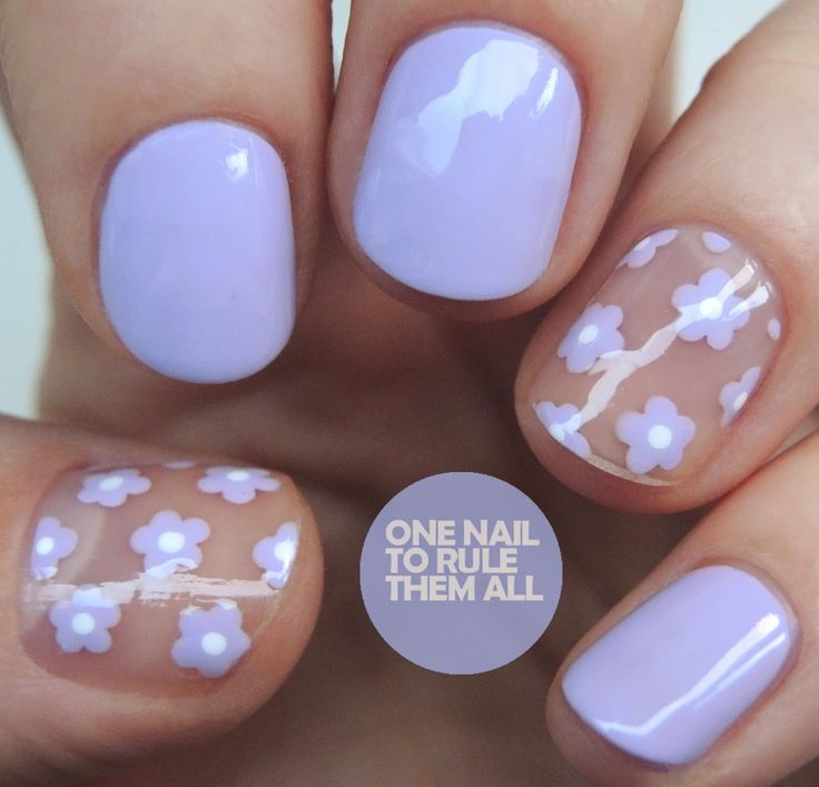 Whimsical Lavender Nail Design with Floral Accents for a Fresh Spring Look.