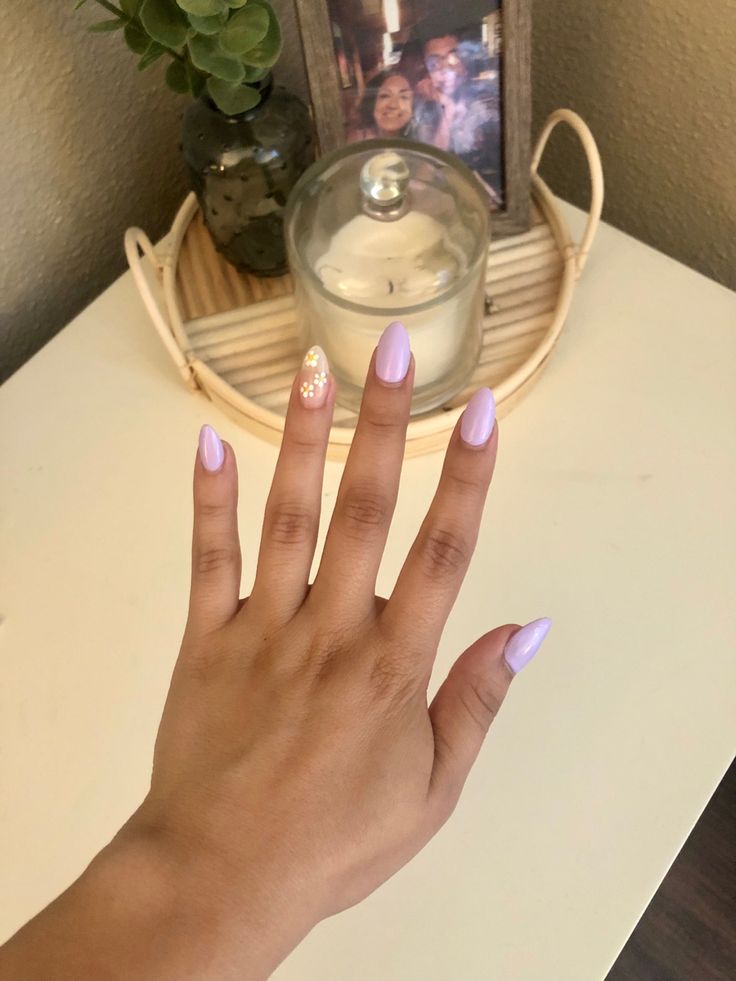 Elegant Lavender Nail Design with Glamorous Gold Accent.