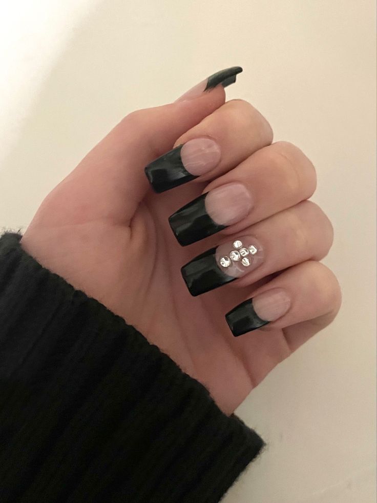 Chic Nail Design: Elegant Black Tips with Nude Base and Gem Accents