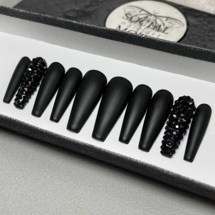 Sleek Matte Black Nail Set with Textured Elegance for Any Occasion.