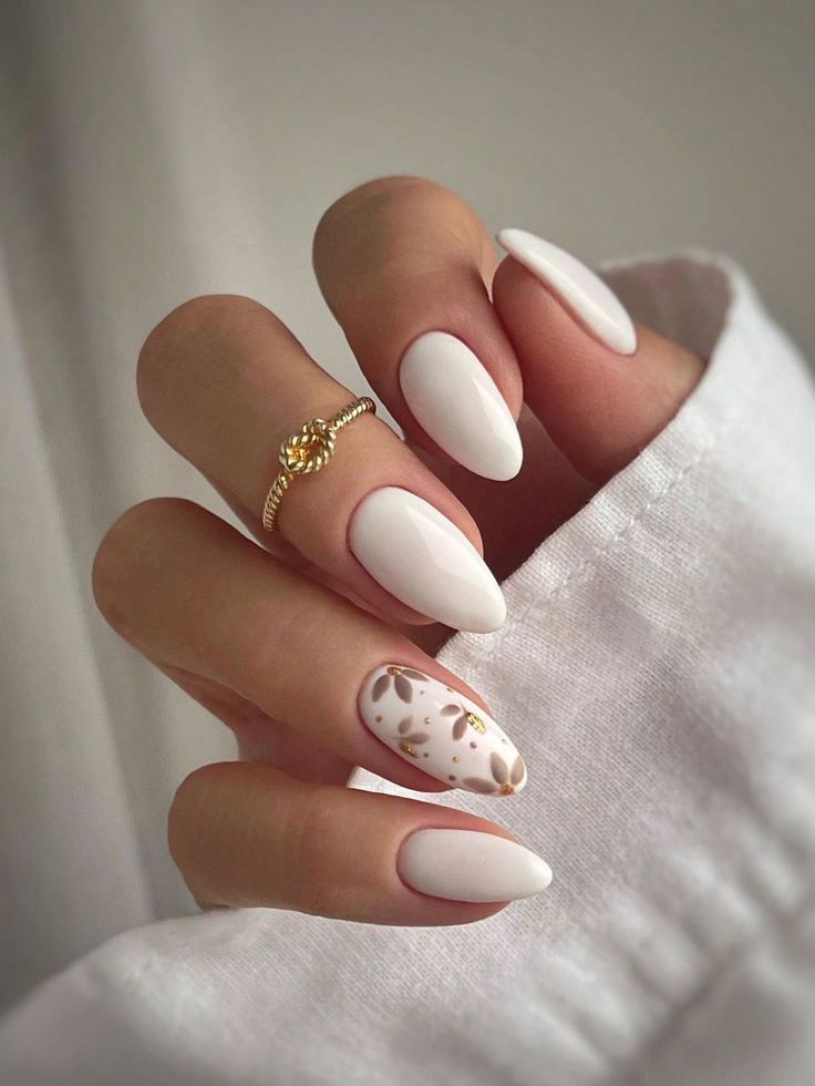 Sophisticated White Almond Nails with Gold Accent Design