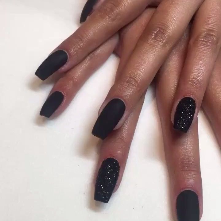 Bold Contrast: Elegant Matte Black Nails with Glittering Accents