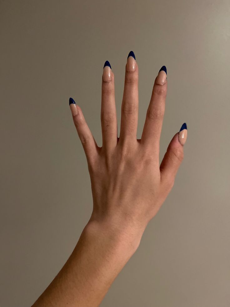 Chic French Tip Manicure with Modern Deep Blue Accents