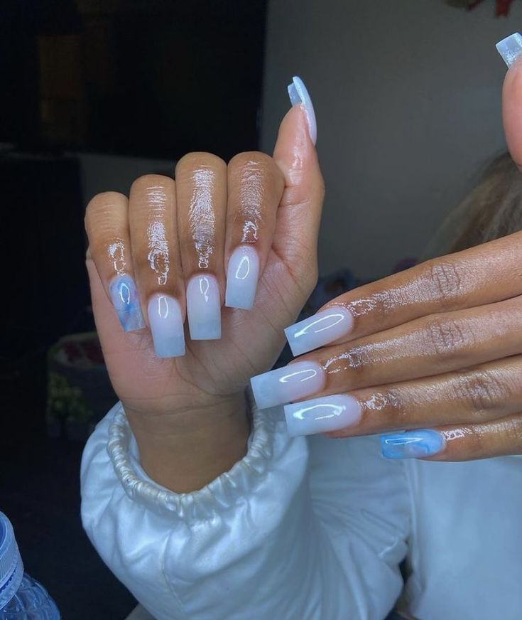 Chic Ombre Acrylic Nails: Elegant Light Blue to White Design with Intricate Details.