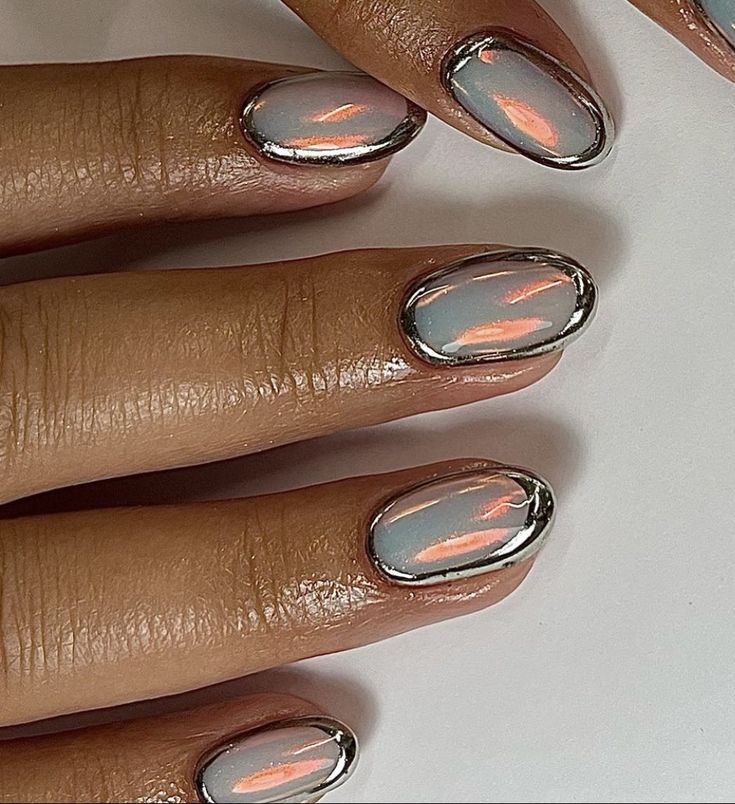 Futuristic Oval Metallic Nail Design with Reflective Chrome Finish and Pastel Hues