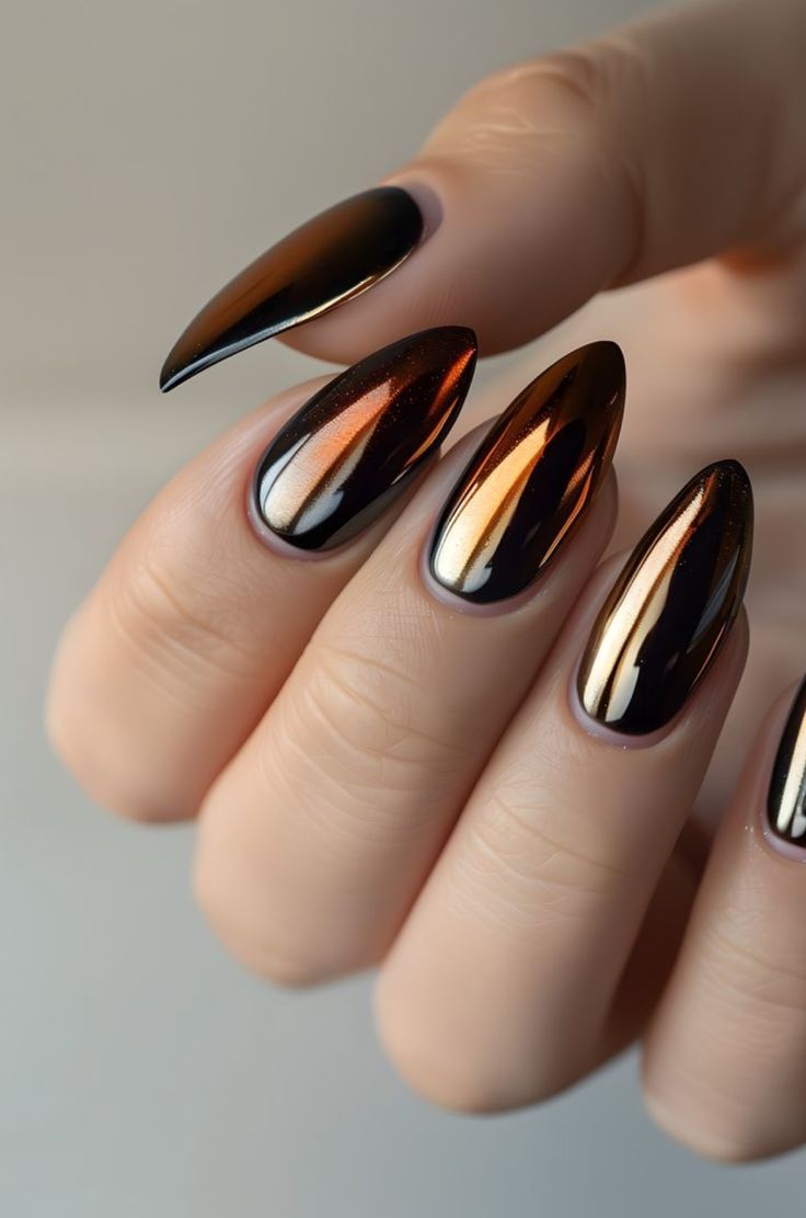 Edgy Ombre Metallic Nail Design: A Bold Blend of Black and Bronze Elegance