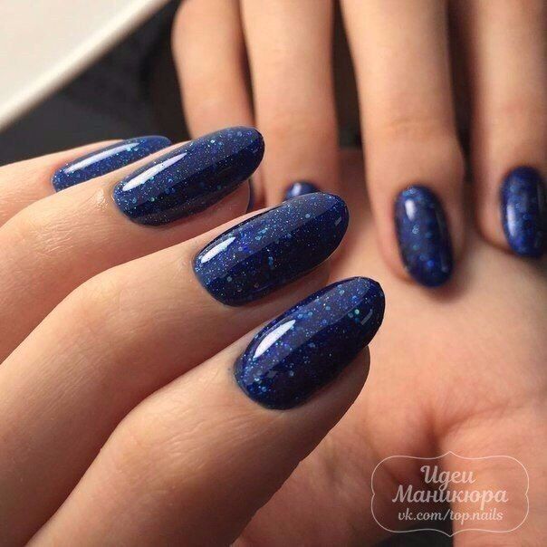 Stunning Sparkling Blue Nail Design: Elegant Navy and Glitter Fusion for Glamorous Style.