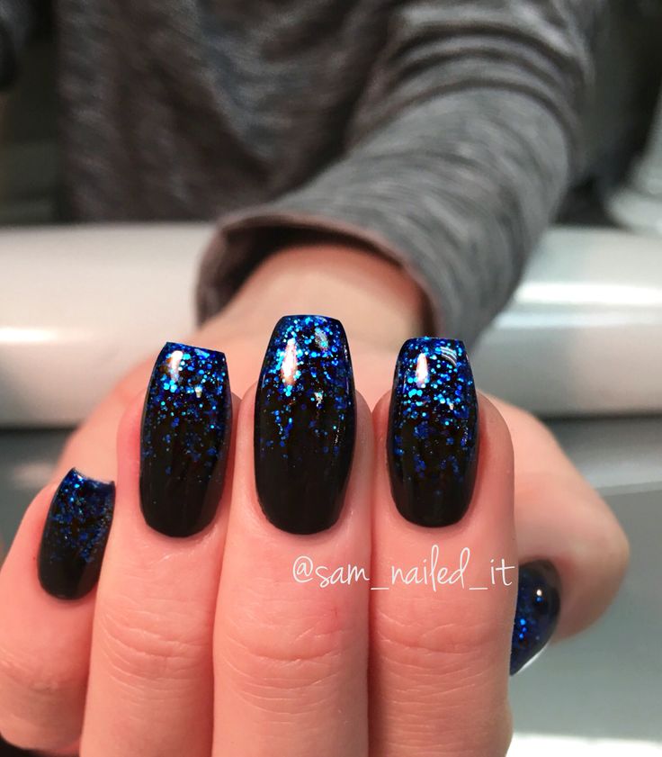 Striking Black and Blue Glitter Nail Design for Bold Evening Elegance.