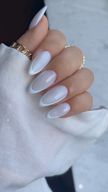 Sophisticated Almond-Shaped Ombre Nails with Glossy Finish and Delicate Accessories.