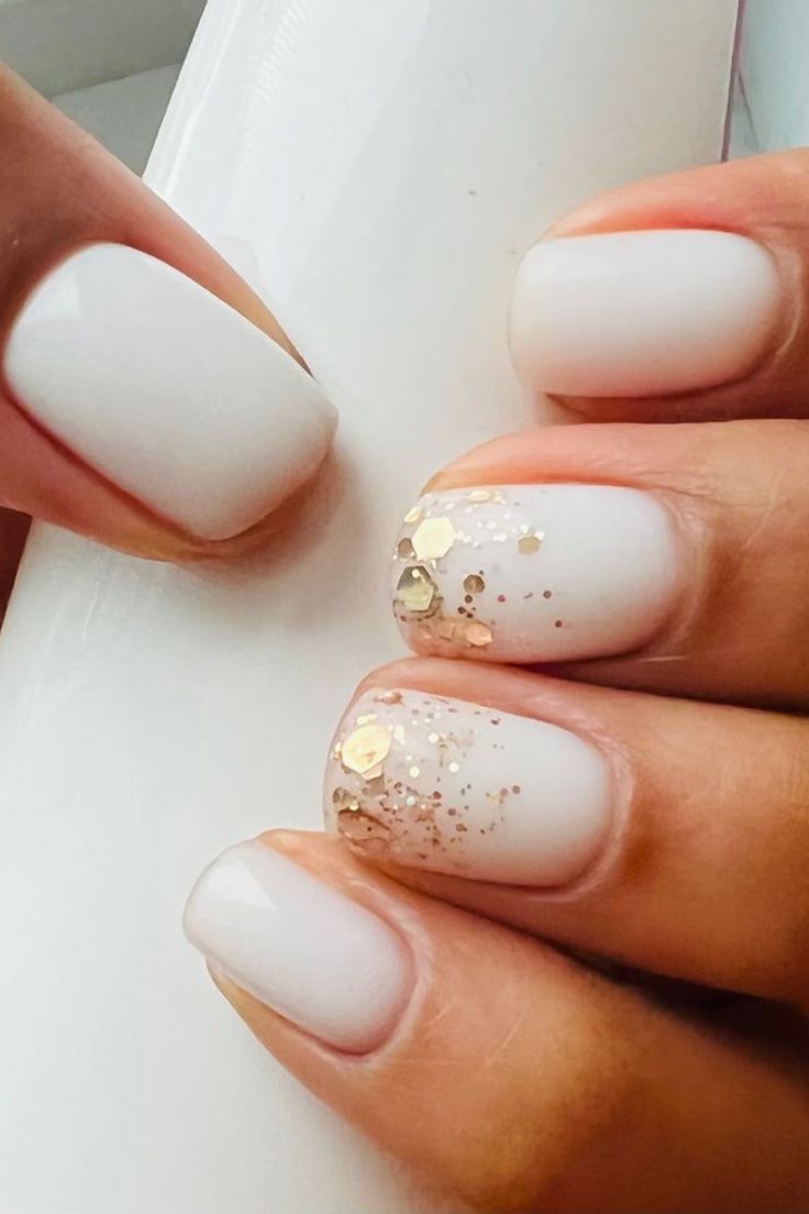 Elegant White Nail Design with Shimmer and Glitter Accents for Any Occasion