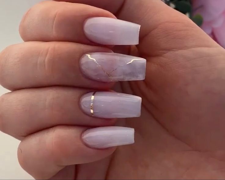 Elegant Lavender Gradient Nail Design with Marble Accents and Gold Detailing.