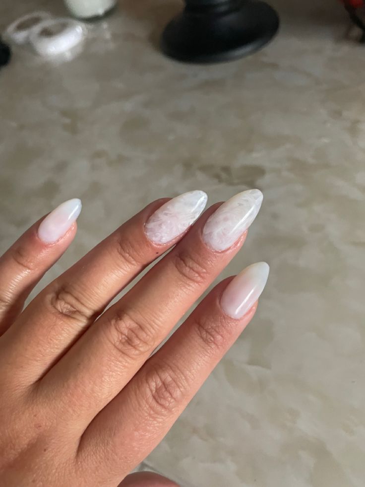 Elegant Ombre Almond-Shaped Nails: A Dreamy Blend of Muted Whites and Pale Pinks for Any Occasion.