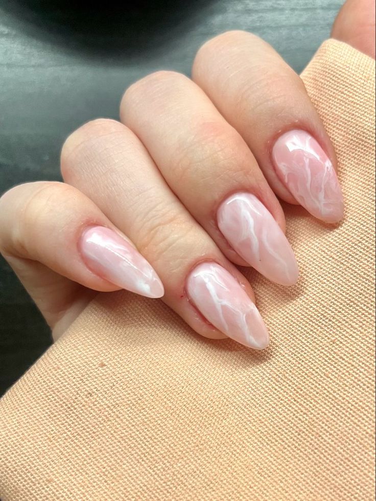 Sophisticated Pink and White Marble Nail Design for Any Occasion.