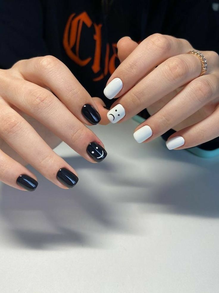 Playful Black and White Nail Design with Emotive Flair