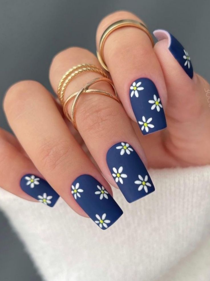 Elegant Navy Floral Nail Design with Matte Finish and Gold Accents