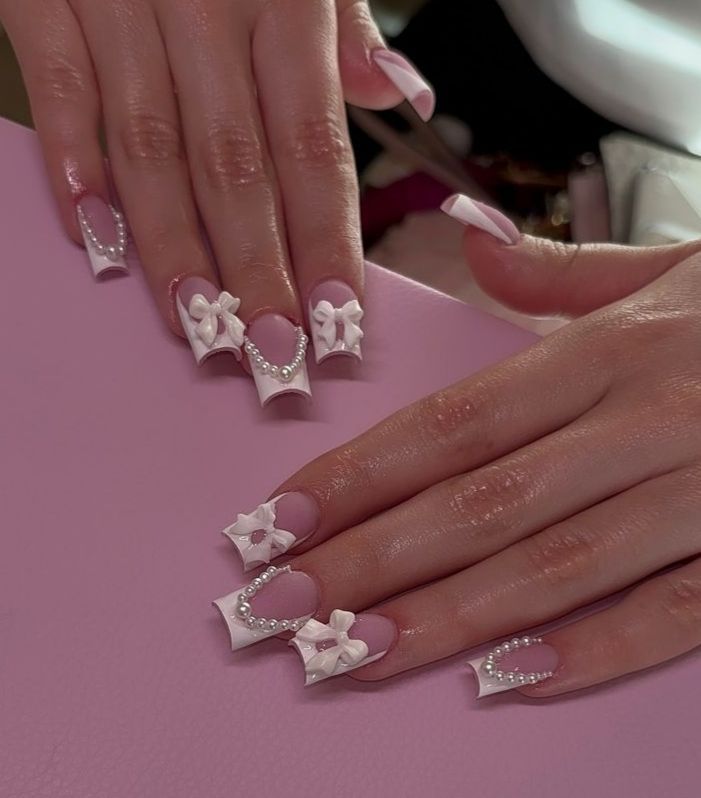 Chic Soft Pink and White Nail Design with 3D Bows and Pearls for Elegant Statement Looks