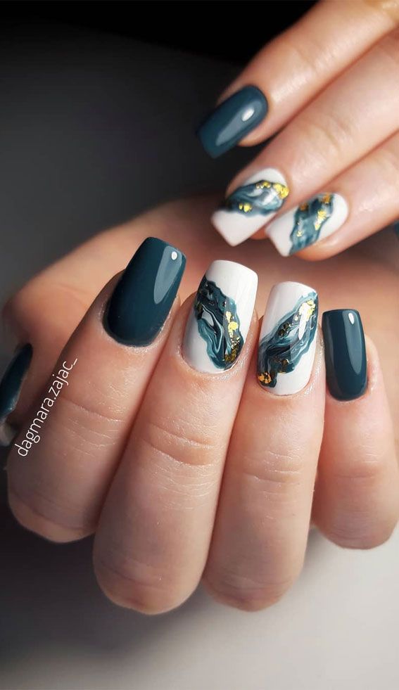 Chic Deep Teal and White Nail Design with Abstract Gold and Blue Accents