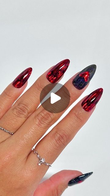 Chic Deep Red and Black Almond Nail Design with Glossy Finish and Heart Accents.