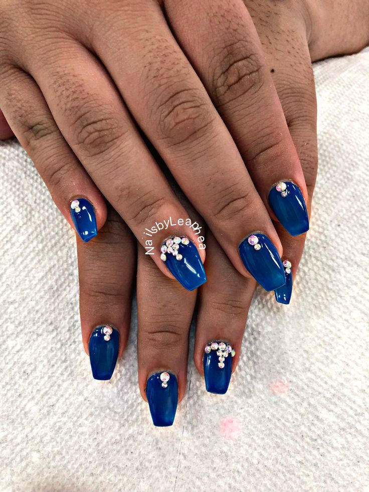 Chic Vibrant Blue Nail Design with Glossy Finish and Elegant Rhinestone Accents.