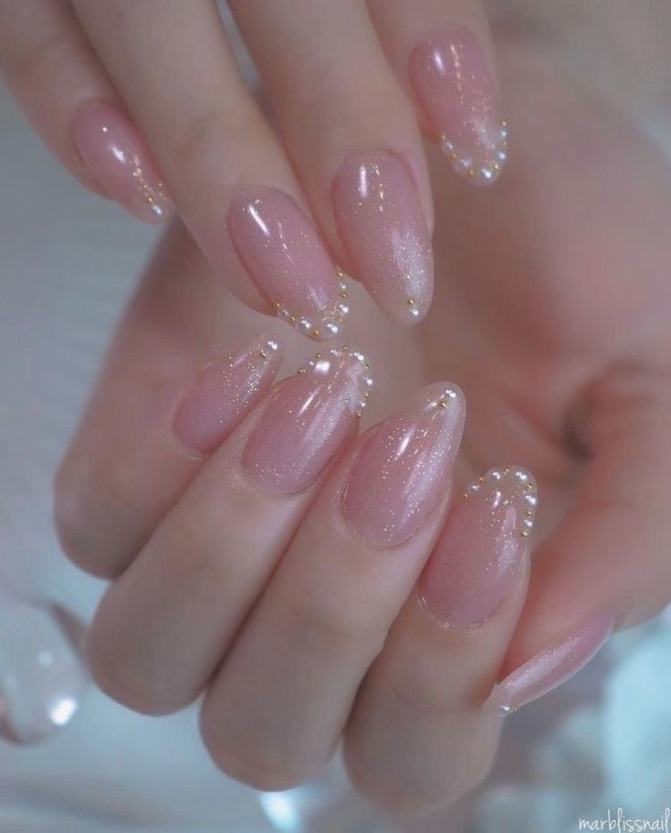 Chic Soft Pink Nail Design with Shimmer and Pearl Accents for Any Occasion