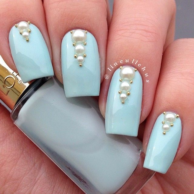 Elegant Soft Blue Nail Design with Glossy Finish and Pearl Accents.