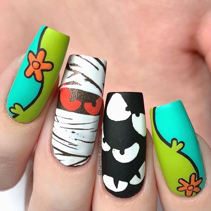 Whimsical Colorful Nail Design with Playful Patterns and Mixed Finishes