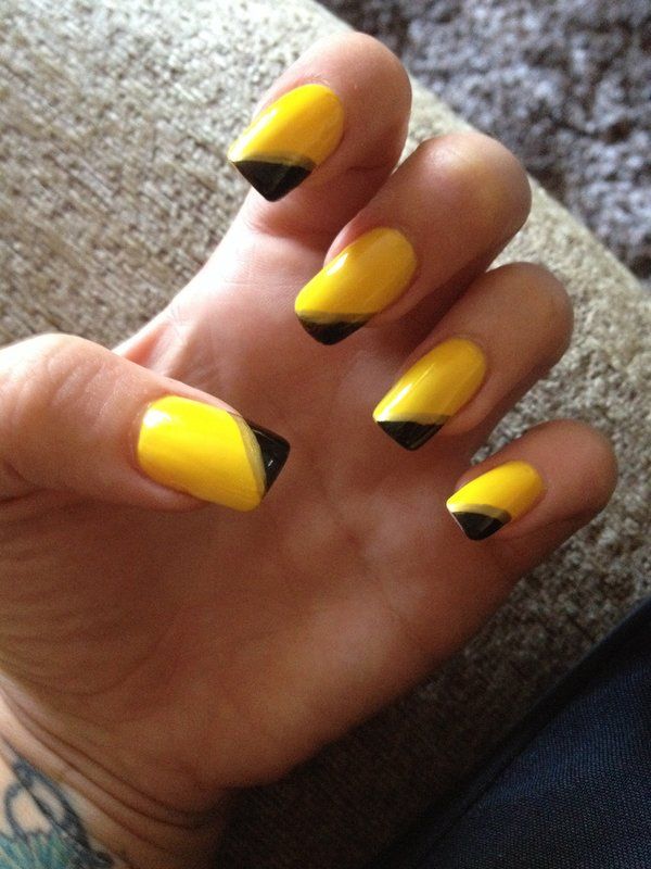 Vibrant Yellow and Bold Black Geometric Nail Design for a Striking Fashion Statement.