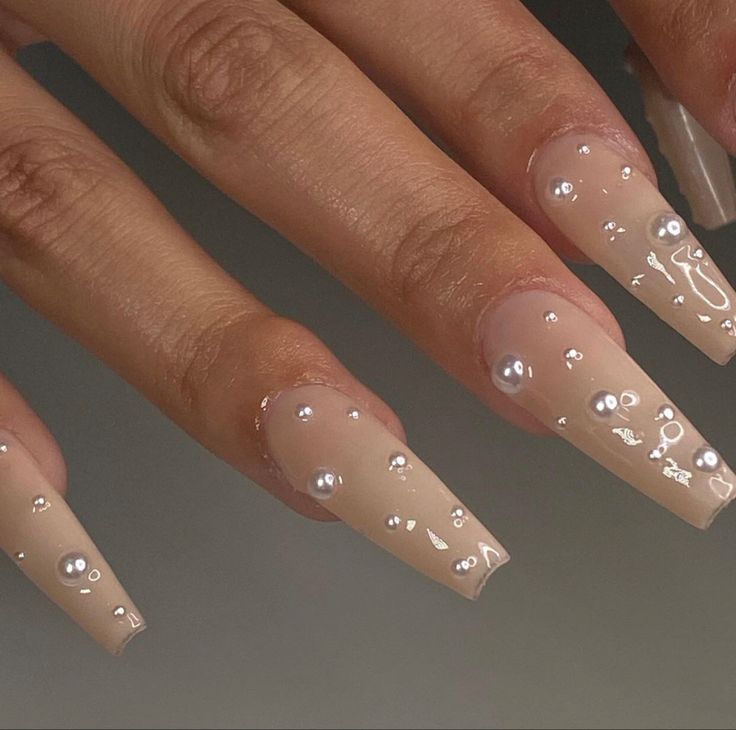 Sophisticated Glamour: Elegant Nude Nails with Pearl Embellishments