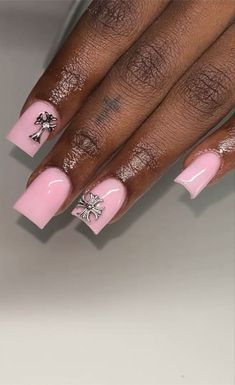 Chic Pink Nails with Metallic Embellishments and Floral Motifs: A Perfect Blend of Elegance and Glamour.