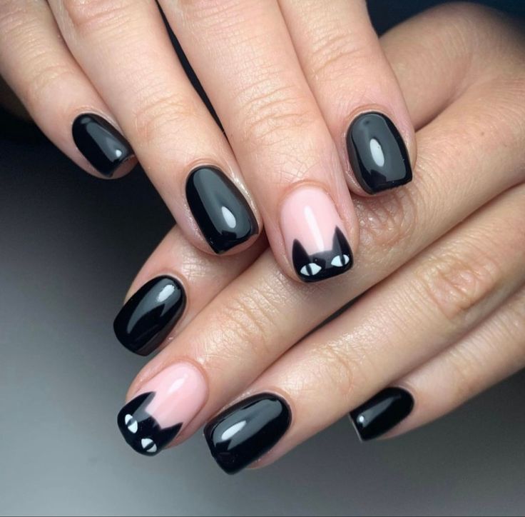 Whimsical Cat-Inspired Nail Design: Elegant Black and Nude with Playful Accents.