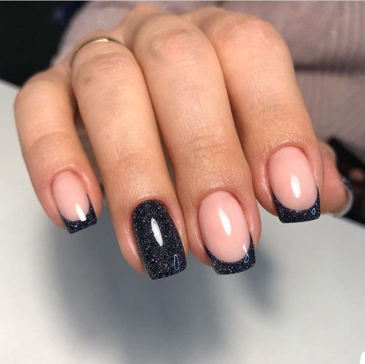 Modern Two-Toned French Manicure with Glossy Black Tips and Sparkling Accents.