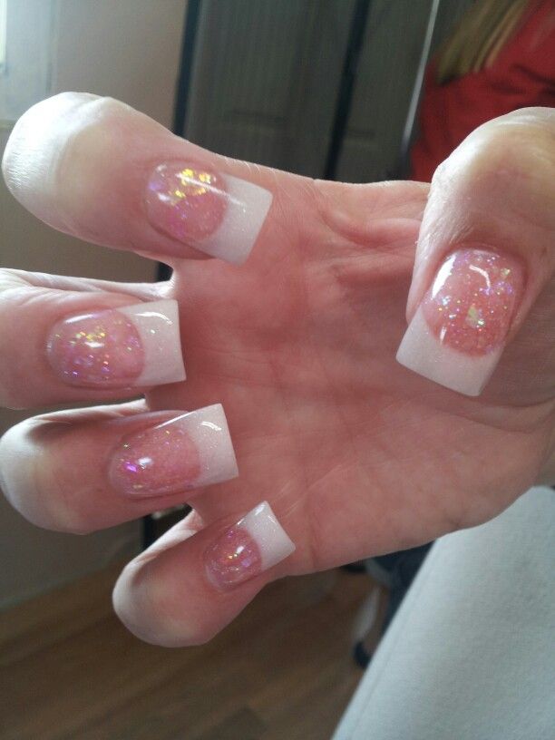 Elegant Pastel Pink French Tip Nail Design with Glittery Accents