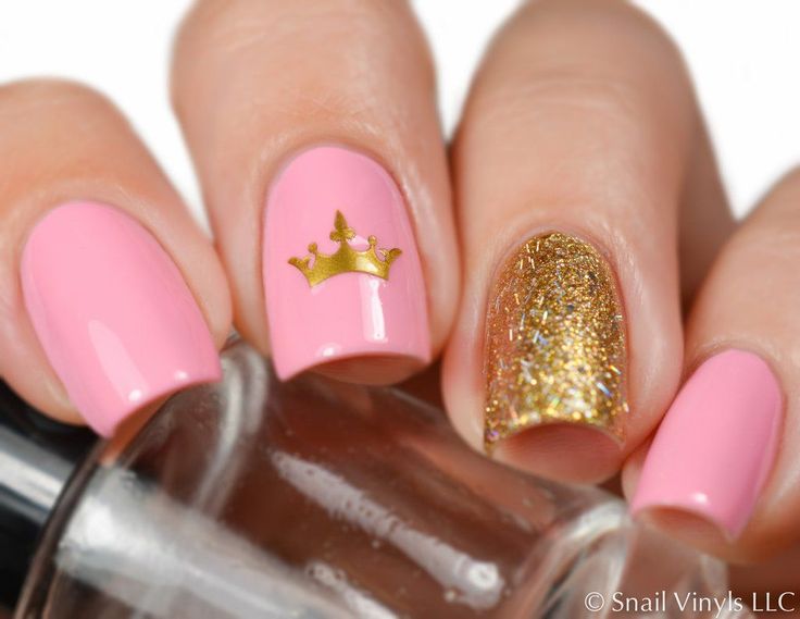 Regal Pink and Glittery Gold Nail Design with Whimsical Crown Accent