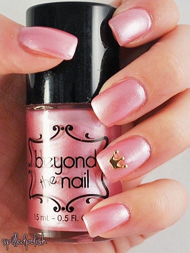 Elegant Soft Pink Nails with Shimmering Finish and Gold Crown Accents