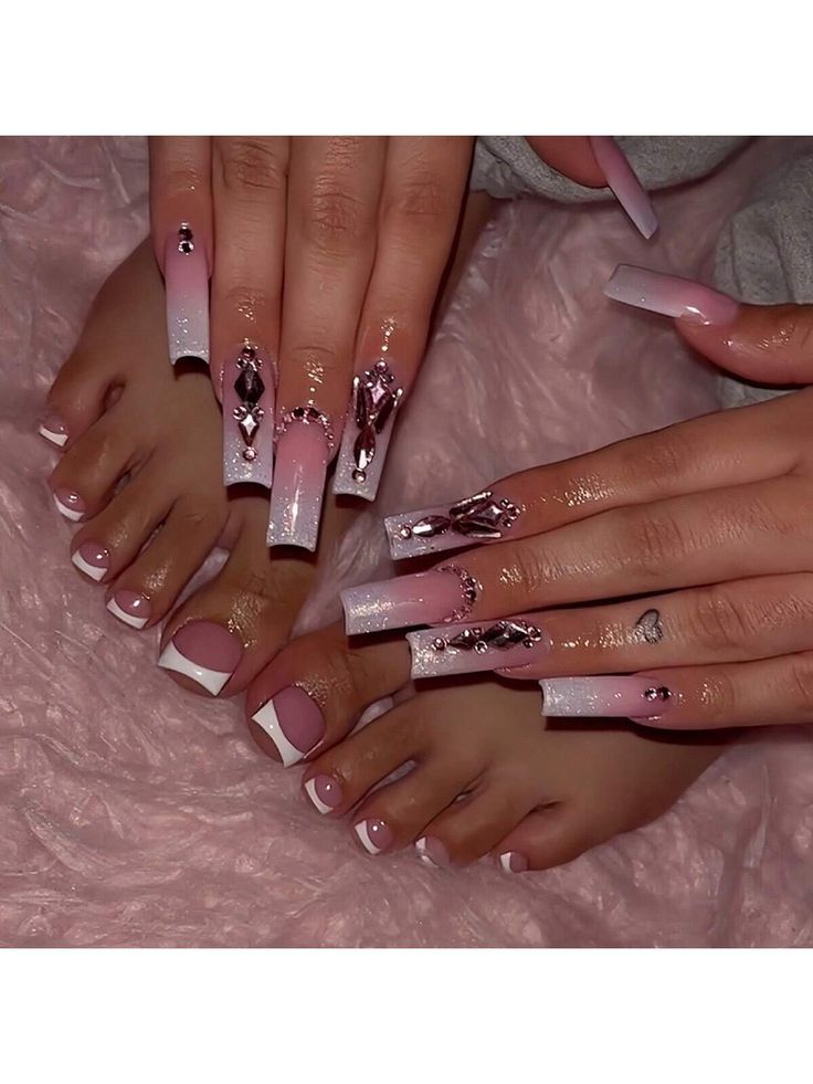 Elegant Ombre Pink and White Nail Design with Gemstone Accents and Coordinating Pedicure.