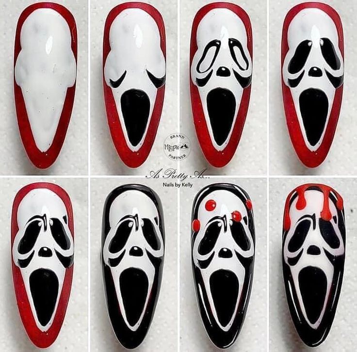 Spooky Nail Art: Intricate Ghostly Face Designs with Black, White, and Red Accents.