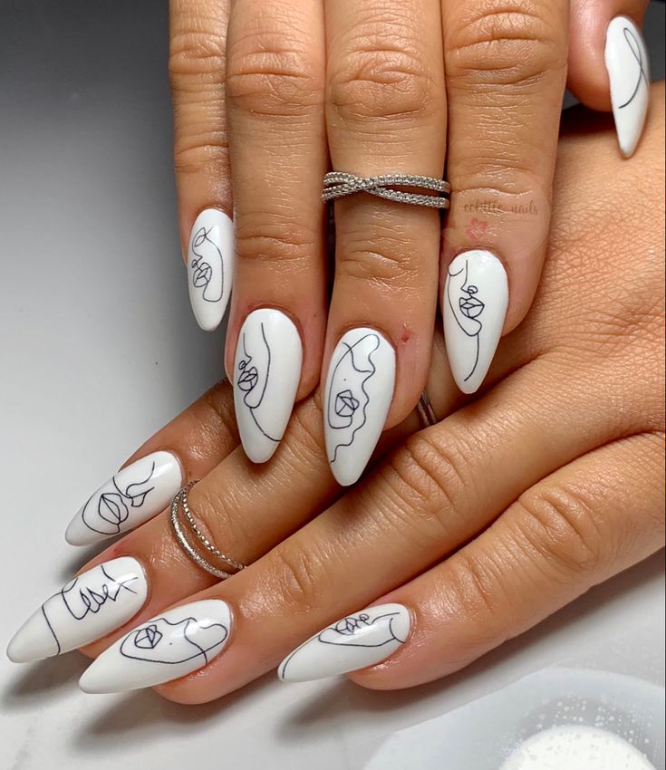 Elegant White Manicure with Intricate Line Art and Modern Aesthetic