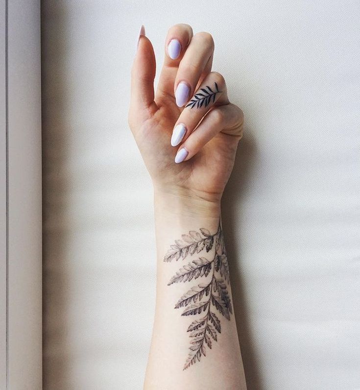 Harmonious Beauty: Soft Lavender Nail Design Paired with Botanical-Inspired Wrist Tattoos.